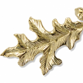 Gold oak-leaf pin given to Alumnae Achievement Award recipients