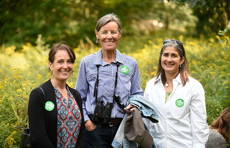 A photo of Suzanne Langridge, Wendy Judge Paulson '69, and Kristina Niovi Jones, taken outdoors on Sustainability Day.