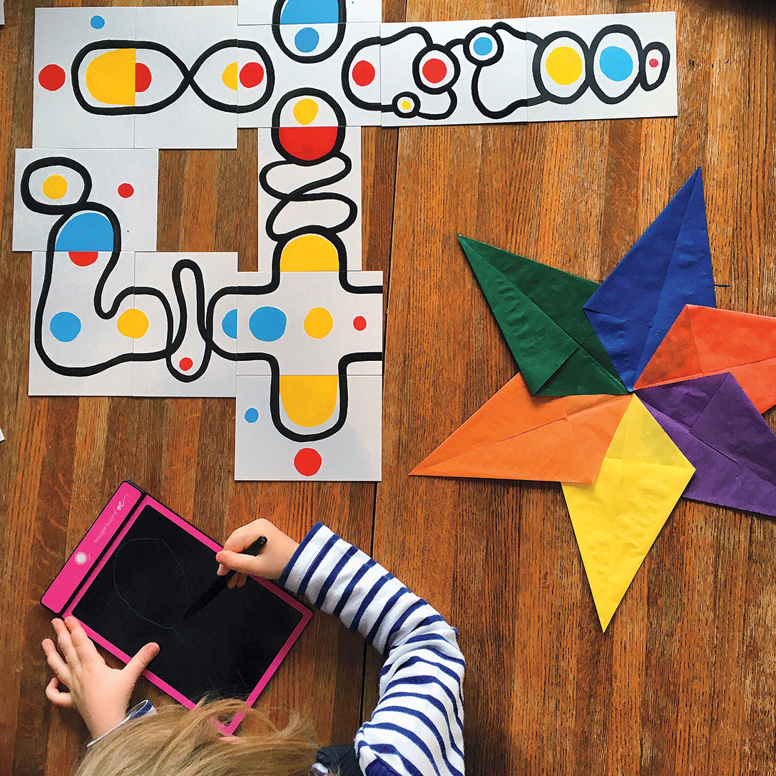 One of the author's children works on a large paper puzzle