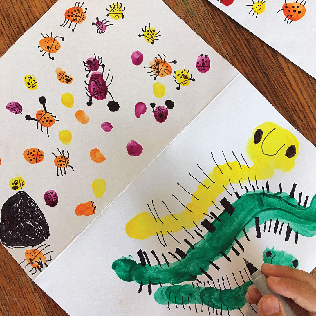 A photo of children's artwork featuring caterpillars