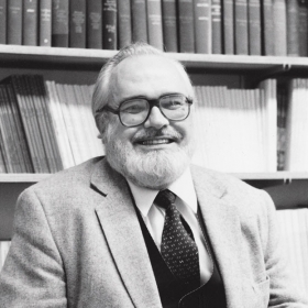 A photo portrait of Edward Hobbes, professor of religion, in his College office