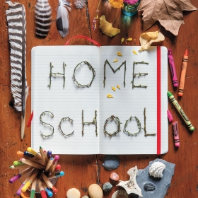 A photo collage around the words "Home School" contains rocks and fatehrs, crayons, leaves, and child-size scissors.