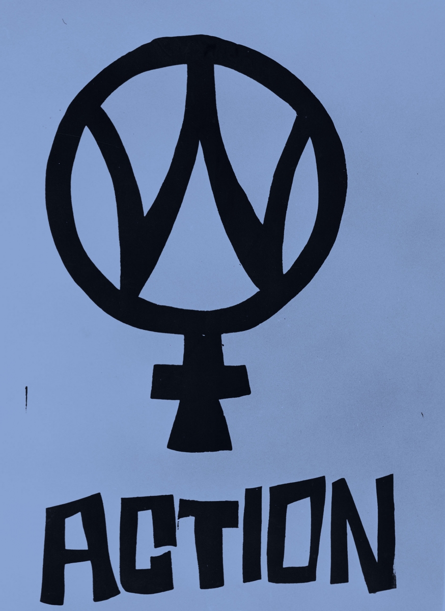 A handmade poster depicts the symbol meaning female with a W inside it, above the word "action."