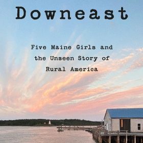 The cover of Downeast is a photograph showing a Maine cove with a lighthouse in the distance.