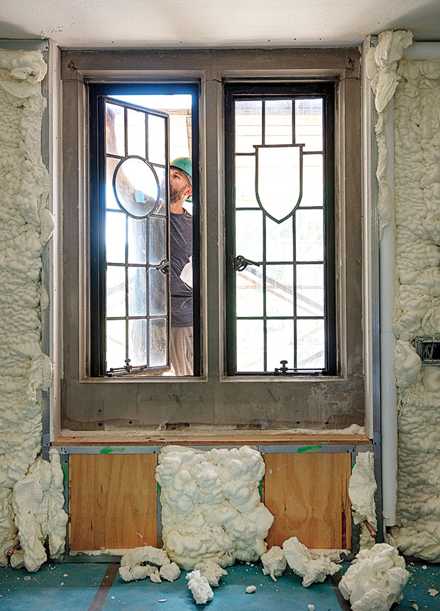 A construction worker makes improvements to a Severance Hall window in July.