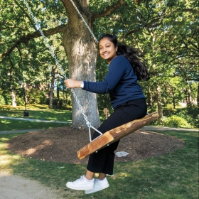 Shreeya Lakkapragada ’26 tries out the swing she designed and had installed on campus