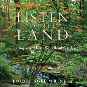 The cover image of Listen to the Land depicts a lush Southern woodland garden with green trees, orange and blue flowers, and a small stream. 
