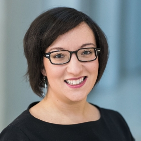 A head shot portrait of a smiling Meagan Lizarazo '04