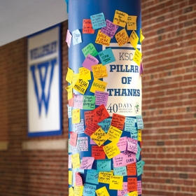 PERA's Pillar of Gratitude in the sports center featuring colorful sticky notes expressing thanks from students for a wide variety of things