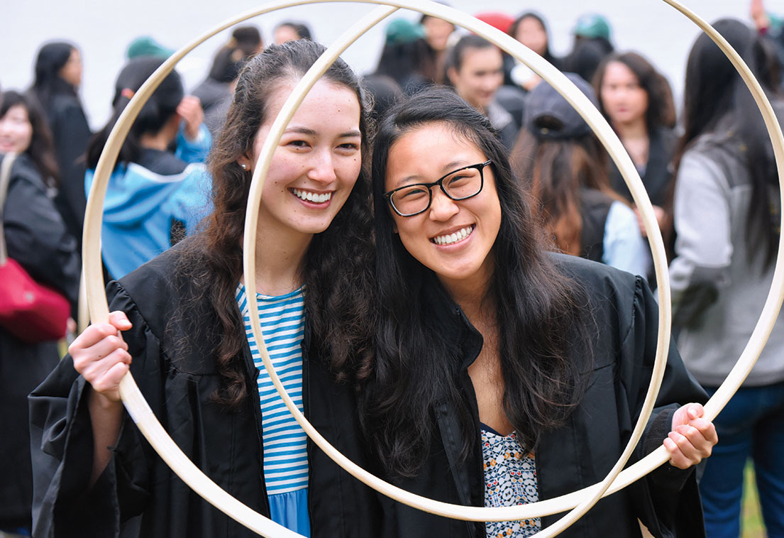 Two students pose with their hoops after the race