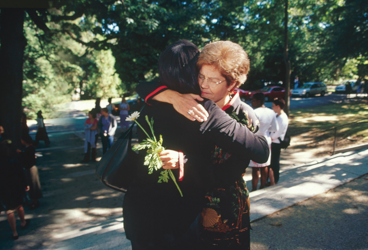 2001: President Diana Chapman Walsh ’66 comforts a student at Flower Sunday, a few days after the 9/11 terrorist attacks.