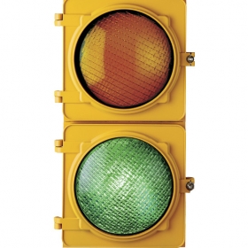 An image of a stoplight, showing only the yellow and green lights. The yellow is unlit; the green is lit.