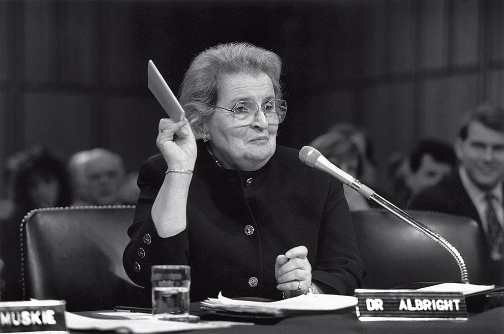 A photo shows Albright holding a copy of the U.N. charter during her confirmation hearing to be U.S. representative to the U.N. on Jan. 23, 1993.