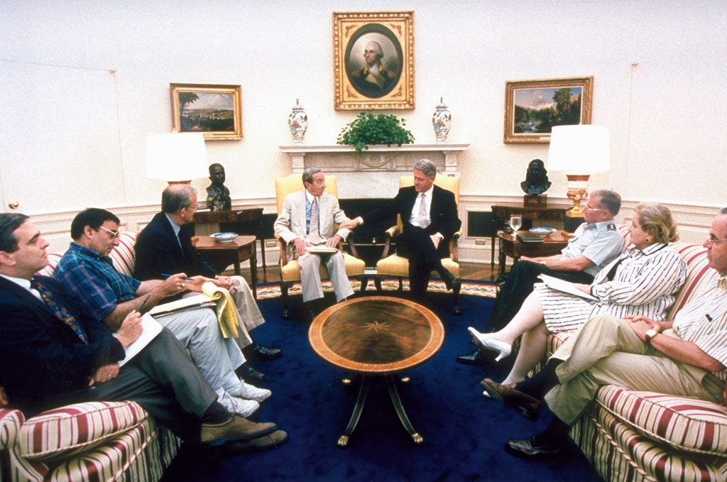 A photo of a foreign policy meeting in 1995 with President Bill Clinton.