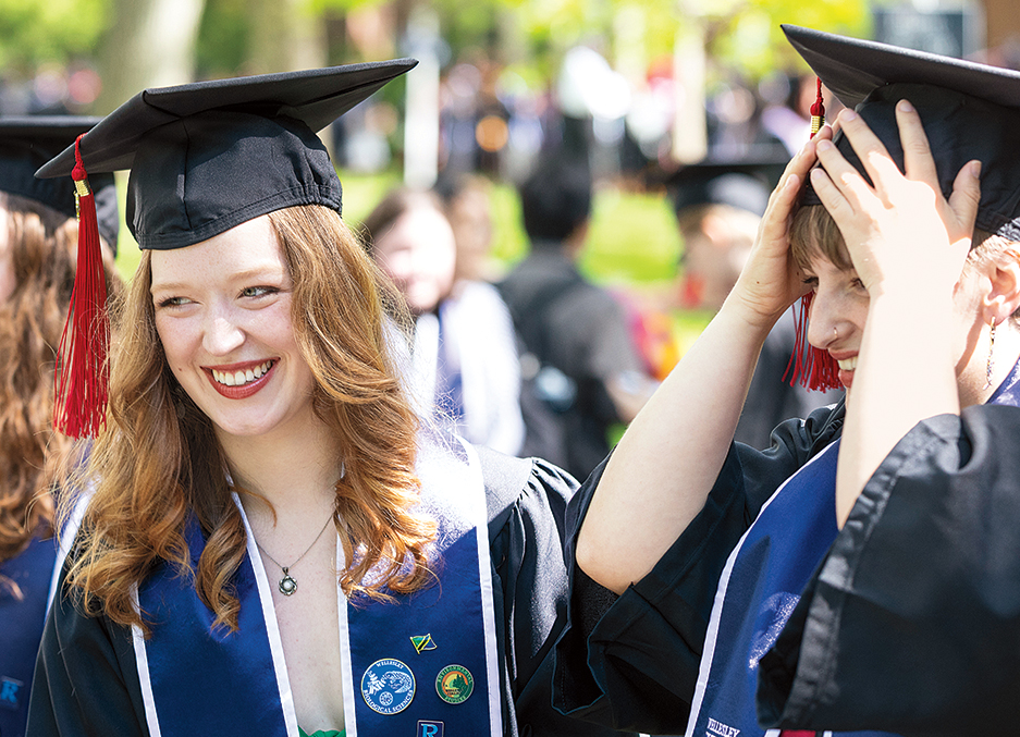 Two smiling graduates