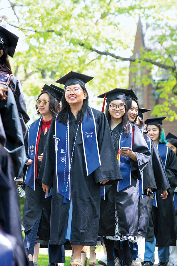 Students process toward the tent