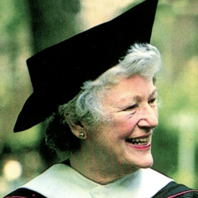 A photo of Betty Freyhof Johnson '44 wearing academic robes.