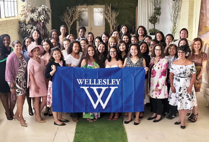 A photo shows members of WAAD and WLAN dressed up and gathered for their annual tea in L.A.