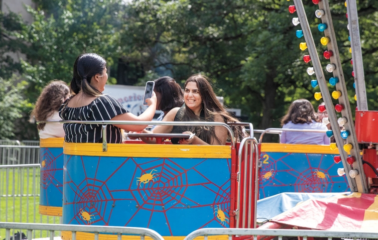 Students enjoy a carnival ride on Lake Day