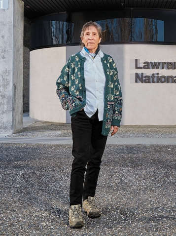 A photo of Judy Harte '68 outside the Lawrence Livermore National Lab in California.