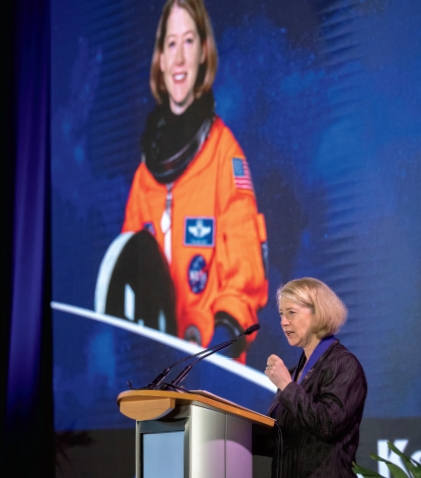 Photo of Pam Melroy speaking at a podium