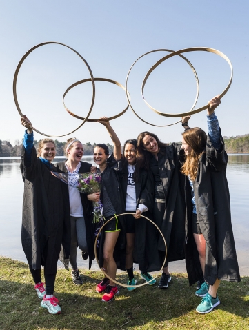 Hooprolling champion Emmy Hamlton '18 and five friends lift their hoops in this photo taken on the shore of Lake Waban