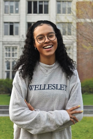 A photo portrait of Tatiana Ivy Moise ’21 wearing a Wellesley T-shirt
