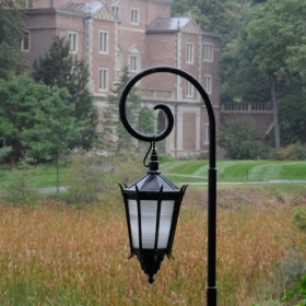 Photography of a Wellesley lantern with Alumnae Hall in the background