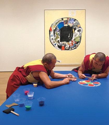 Photo of monks assembling a mandala out of sand in the Davis Museum.