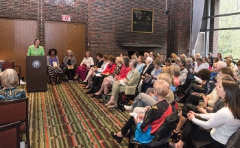 An audience gathered in the College Club for an Authors on Stage event.