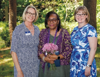 Photo of Laura Wood Cantopher ’84, former WCAA president; Debra DeVaughn ’74; and Kathryn Harvey Mackintosh ’03, executive director of the WCAA.