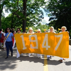 The Class of 1947 holds their yellow banner