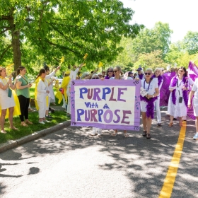 The class of 1978 with their "Purple with a Purpose" banner