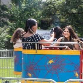 Students enjoy a carnival ride on Lake Day