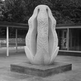 A black and white photo shows the Persephone sculpture