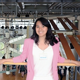 A photo of Charlotte Kiang '13 standing in the European Astronaut Centre in Germany