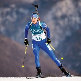 A photo of biathlete Clare Egan '10 cross-country skiing during the 2018 Winter Olympics. 