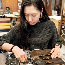 A student sets type