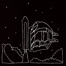 White embroidery on black cloth of a two-masted ship attached to an external tank and solid rocket boosters