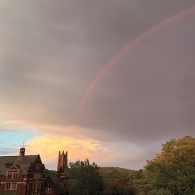 A photo shows a gorgeous rainbow arching above campus.