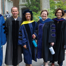 Faculty members in academic regalia before commencement