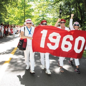 Members of the red class of 1960 hold their banner
