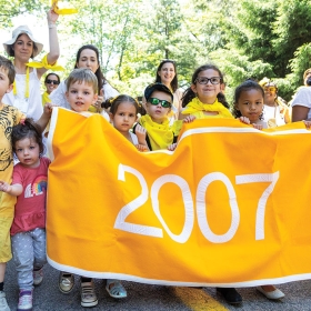 The yellow class of 2007 poses with their banner