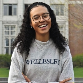 A photo portrait of Tatiana Ivy Moise ’21 wearing a Wellesley T-shirt
