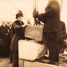 President Ellen Fitz Pendleton, class of 1886, places the cornerstone of Tower Court in 1915.