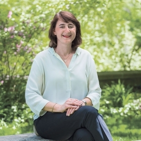 Martha Goldberg Aronson ’89, president, Wellesley College Alumnae Association, sits on a bench outside Green Hall